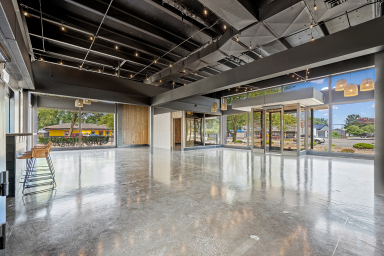 View from the back entrance of the open event space with natural light and modern touches of The Vault event center in Garrett, Indiana.
