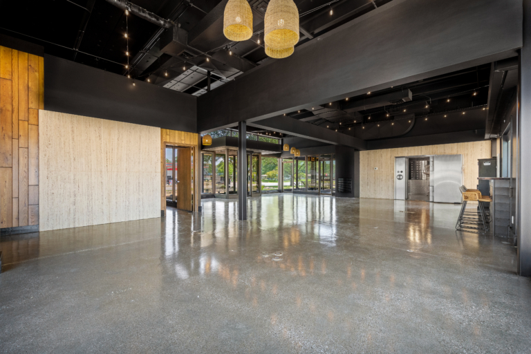 View from the back of the open event space with natural light and modern touches of The Vault event center in Garrett, Indiana.